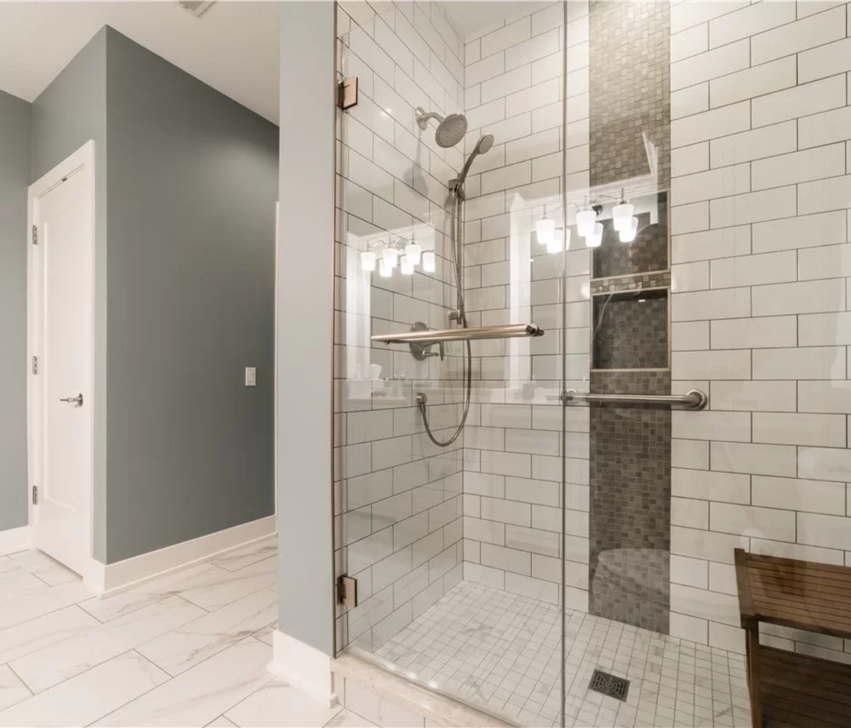 Bathroom remodeling in Chicago — tiled walk-in shower and modern fixtures by AMG Proline